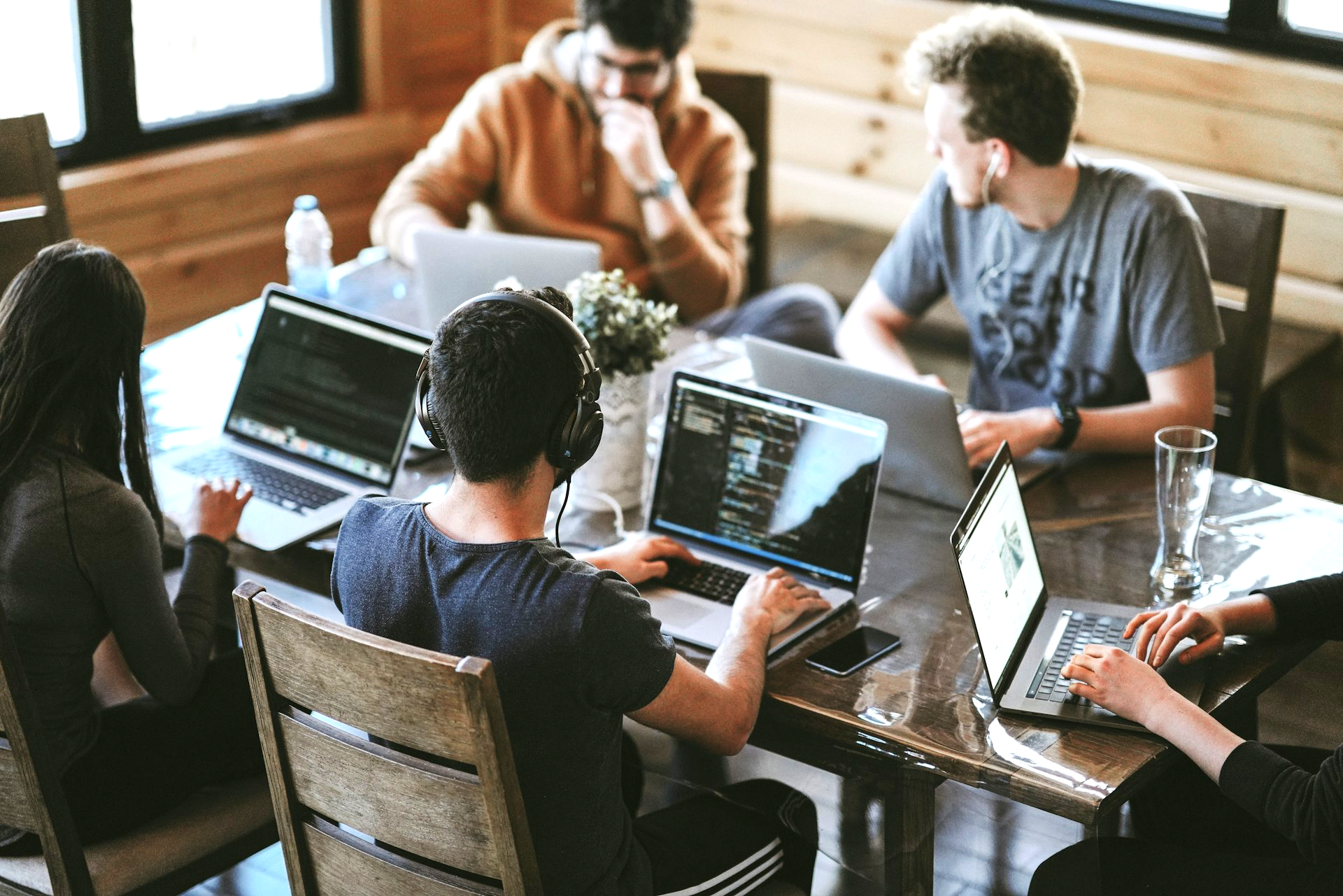 group of people using laptop computer